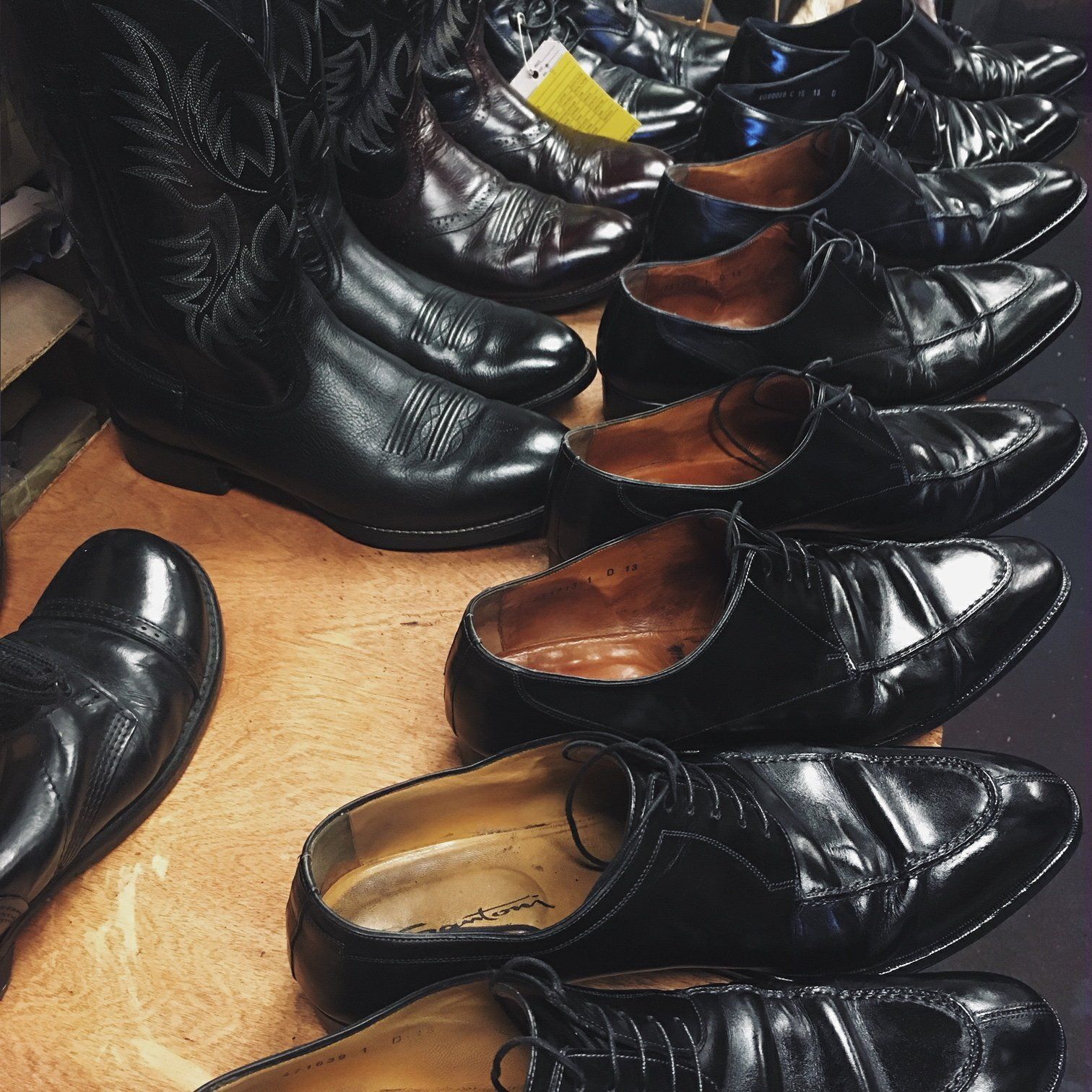 Leather boots and polished shoes pictured on Byrum’s original about page